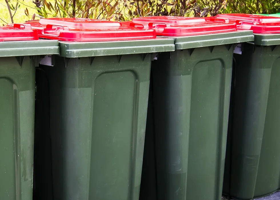 Wheelie bins lined up for cleaning in Leeds